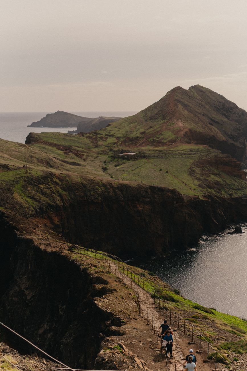 Ancient stone path winding through green valleys